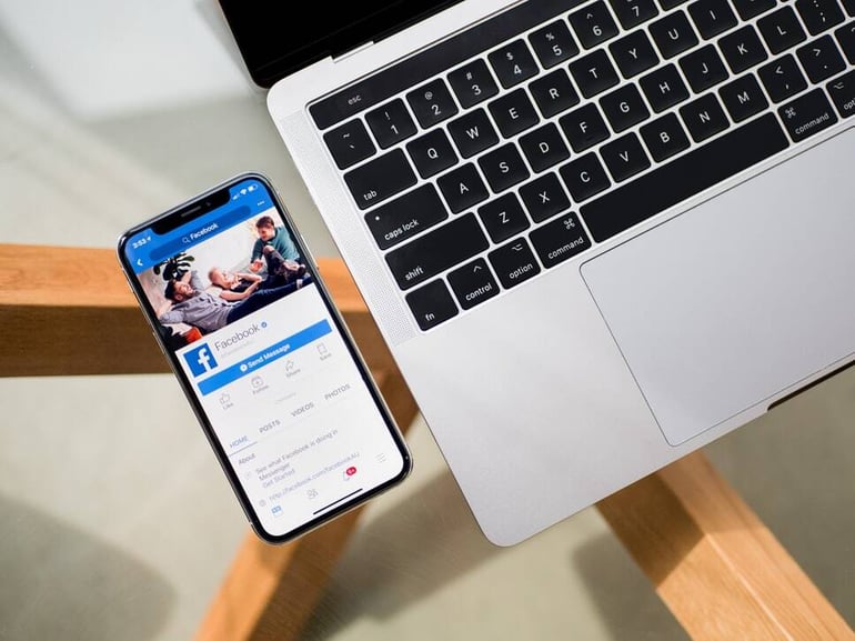 Phone Facebook and laptop